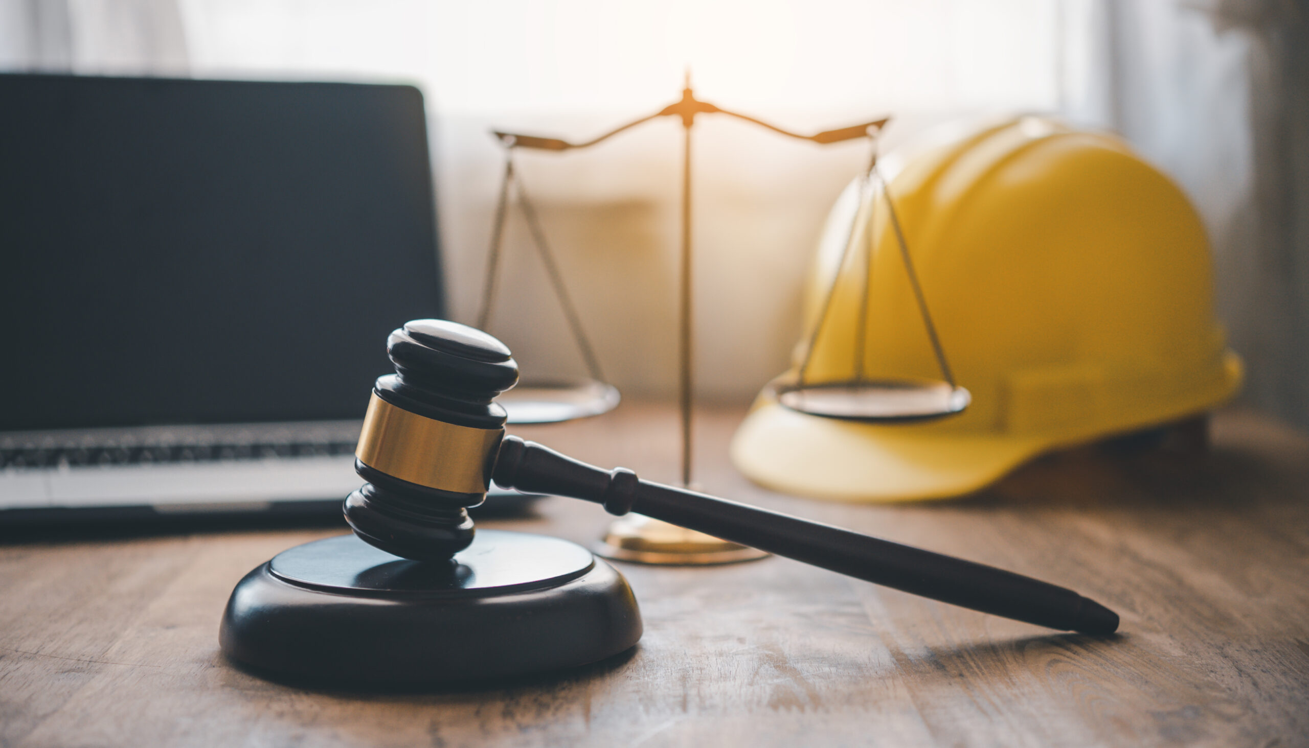 Judge’s hammer and helmet Law and Justice about labor law concep